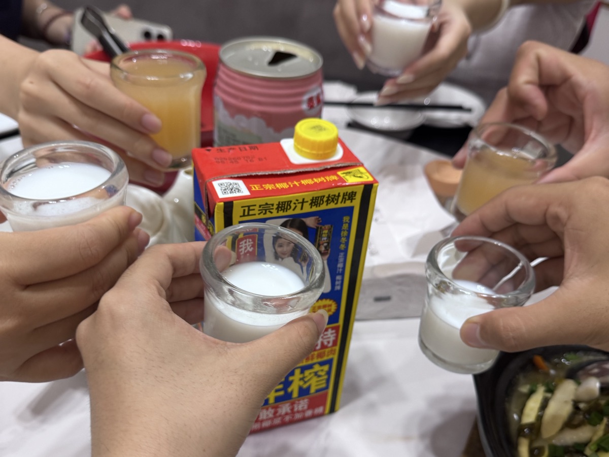 Lab members raising their glasses at the first group dinner of 2026